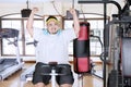 Excited fat man using an exercise bike Royalty Free Stock Photo