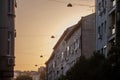 Selective blur on a facade of a residential multistorey building, with old grey facade, at sunset, in the city center of Belgrade