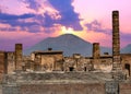 Pompeii and Mount Vesuvius against a vibrant sunset