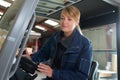 Picture female forklift driver focusing at work