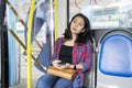Female passenger falling asleep on the bus seat