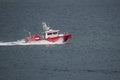 A picture of a fireboat moving on the ocean.