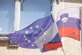 Flags of the European Union and Slovenia waiving together in the Slovenian capital city, Ljubljana. Slovenia is a member of the EU