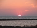 Amazing natural pictures of the sunset over the water mirror of the salt lake Sivash. Royalty Free Stock Photo