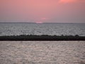 Amazing natural pictures of the sunset over the water mirror of the salt lake Sivash. Royalty Free Stock Photo