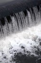 A picture of the flowing water. The dam is designed to regulate the water level in rivers within the city and to provide technical Royalty Free Stock Photo