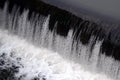 A picture of the flowing water. The dam is designed to regulate the water level in rivers within the city and to provide technical Royalty Free Stock Photo