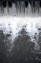 A picture of the flowing water. The dam is designed to regulate the water level in rivers within the city and to provide technical Royalty Free Stock Photo