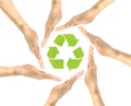 Picture four hands in which the eco-arrow icon Royalty Free Stock Photo