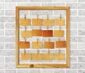 Picture frame and antique note papers on white brick wall Royalty Free Stock Photo