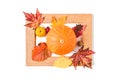 Picture frame with autumn leaves, quince and orange pumpkin. Creative thanksgiving day or halloween concept