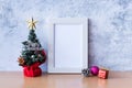 Picture frame and Christmas decoration - Santa Clause and gift on wooden table. Christmas and Happy new year concept Royalty Free Stock Photo