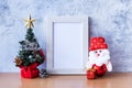 Picture frame and Christmas decoration - Santa Clause and gift on wooden table. Christmas and Happy new year concept Royalty Free Stock Photo