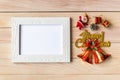 Picture frame and Christmas decoration - Santa Clause and gift on wooden table. Christmas and Happy new year concept Royalty Free Stock Photo