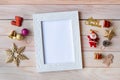 Picture frame and Christmas decoration - Santa Clause and gift on wooden table. Christmas and Happy new year concept Royalty Free Stock Photo