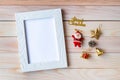 Picture frame and Christmas decoration - Santa Clause and gift on wooden table. Christmas and Happy new year concept Royalty Free Stock Photo