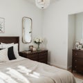 Picture frame and flowers on a dresser in a contemporary bedroom. (Picture in frame is mine.)