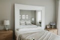 Picture frame and flowers on a dresser in a contemporary bedroom. (Picture in frame is mine.)