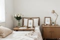 Picture frame and flowers on a dresser in a contemporary bedroom. (Picture in frame is mine.)