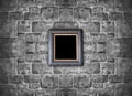 Picture frame hanging on stone brick wall Royalty Free Stock Photo