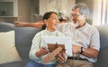 Picture frame, happy and senior couple on a sofa bonding, talking and relaxing together in living room. Smile, laugh and Royalty Free Stock Photo