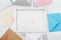 Picture frame with mail envelopes border mockup or template top view. Styled background for correspondence design. Flat lay.