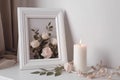 Picture frame mock up and small decorations. Generative Ai Royalty Free Stock Photo