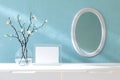 Picture frame mock up on a white sideboard and a wall mirror. 3d rendered illustration
