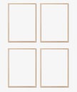 Picture frame mockup. Set of four vertical oak wooden frames on white wall. Templates for artwork, painting or poster