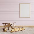 Picture frame on a pink wooden wall In the children`s room, wooden toys were placed on the carpet on the floor.3d rendering