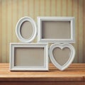 Picture frame on wooden table over vintage background Royalty Free Stock Photo