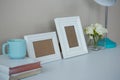 Picture frames, coffee cup with and flower vase