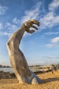 Giant arm monument by the ocean