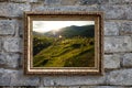 The picture in a gold frame on a background of an old brick wall Royalty Free Stock Photo