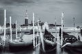 Picture with gondolas moored on Grand Canal near Saint Mark square, in Venice Italy. Black and white photography Royalty Free Stock Photo