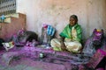 Picture of grandmother who is priest in a hindu temple wearing traditional cloths