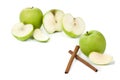 Picture of green apples and sticks of cinnamon on the white bac Royalty Free Stock Photo