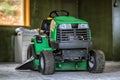 Picture of green lawn mower in the garage Royalty Free Stock Photo