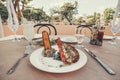 picture grilled lobster with fresh tomato and cucumber on white plate rice and a cocktail glass on the tablecloth. Beautiful