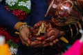 Picture of groom and bride holding hands and worship hindu god during wedding rituals Royalty Free Stock Photo