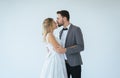 Picture of groom with bride romantic couple is kissing and hugging together on white background,Positive thinking in wedding day,C Royalty Free Stock Photo