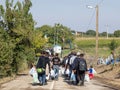 Refugees walking towards the Croatian border crossing on the Croatia Serbia border, between the cities of Bapska and Berkasovo