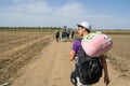 Refugees walking through the fields near the Croatia Serbia border, between the cities of Sid Tovarnik on the Balkans Route,