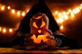 Picture of halloween pumpkin cut in shape of face with witch Royalty Free Stock Photo