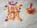 Swastika and diya Rangoli created only with flowers