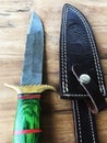 Hand Made Damascus hunting knife and sheath Royalty Free Stock Photo