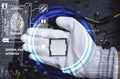 Picture of a hand wearing white gloves with a CPU chip placed on it Royalty Free Stock Photo