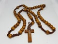 A handmade wooden rosary on white background Royalty Free Stock Photo