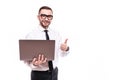 Picture of handsome young bearded man holding laptop showing thumbs up standing over white wall background isolated Royalty Free Stock Photo