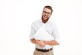 Handsome young bearded man holding laptop. Royalty Free Stock Photo